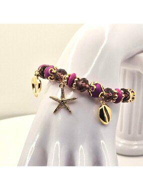 Purple And Gold Tone Beaded Charm Bracelet With Heart Starfish And Shell Pendant